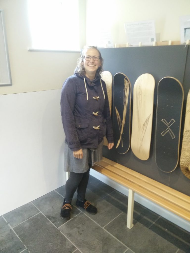 Anna Mawby with her laser engraved skateboard design at the Wirksworth Festival