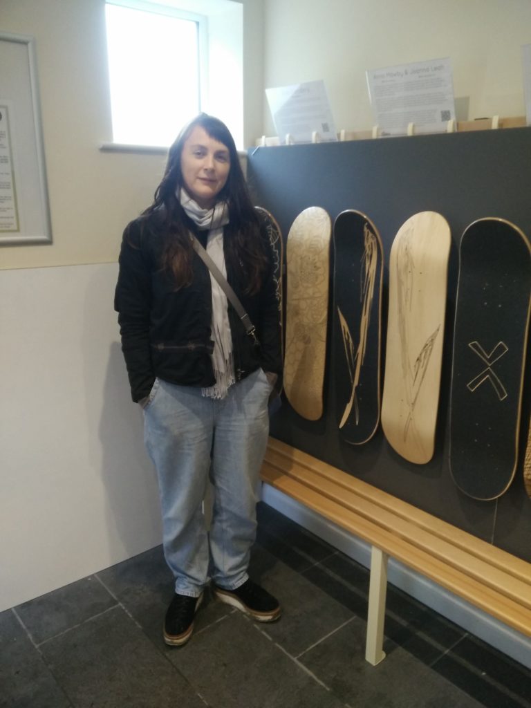 Joanna Leah with her laser engraved skateboard design at the Wirksworth Festival